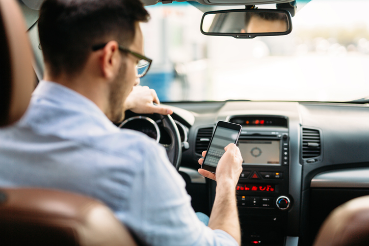Graphic of person driving car representing Washington Study Guide