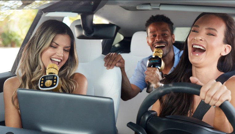 A driver adjusting the car radio while driving in San Antonio, highlighting the risks of distracted driving.