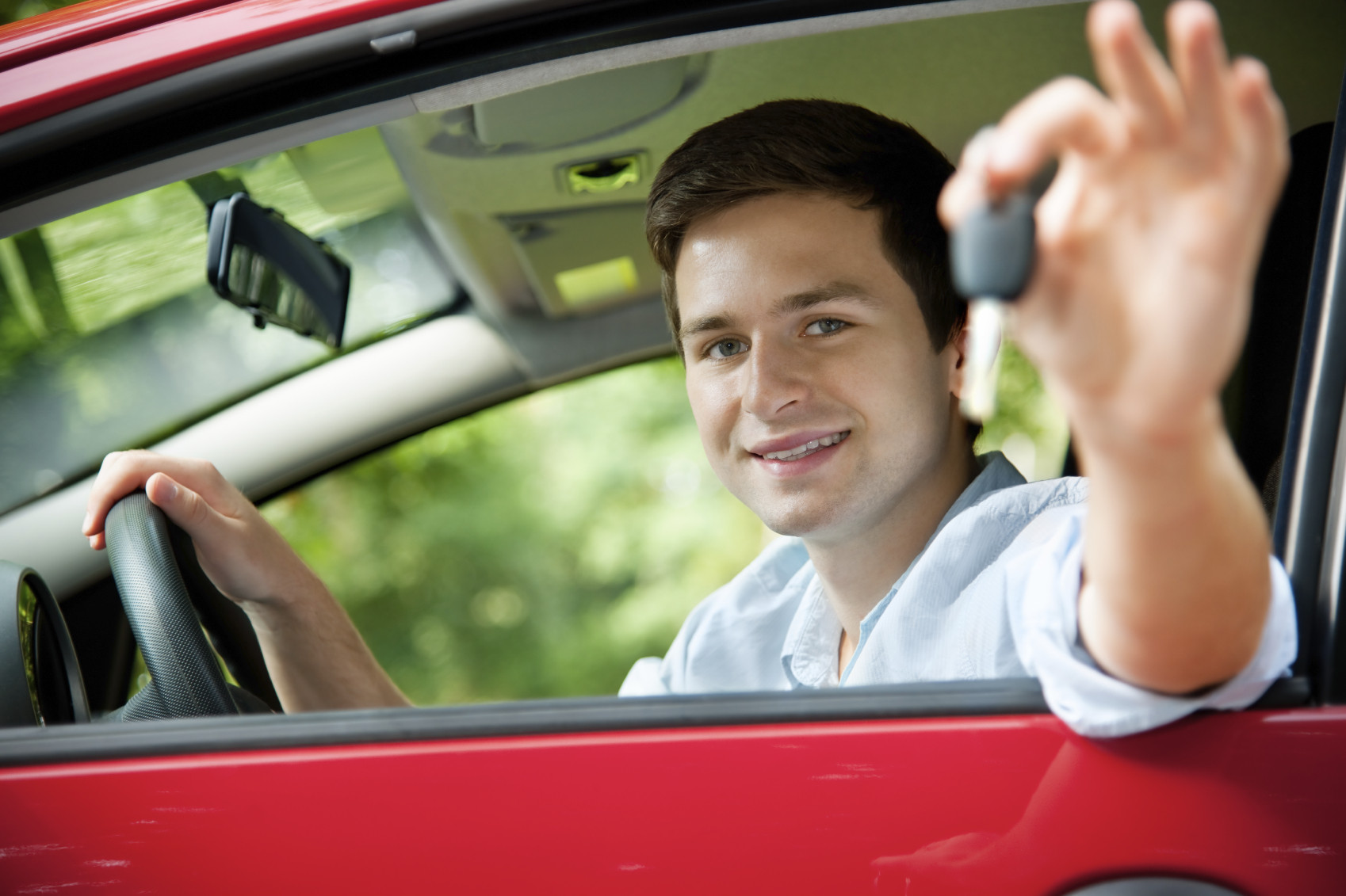 A parent and teen during a driving lesson, with guidance from Get Drivers Ed’s comprehensive materials.