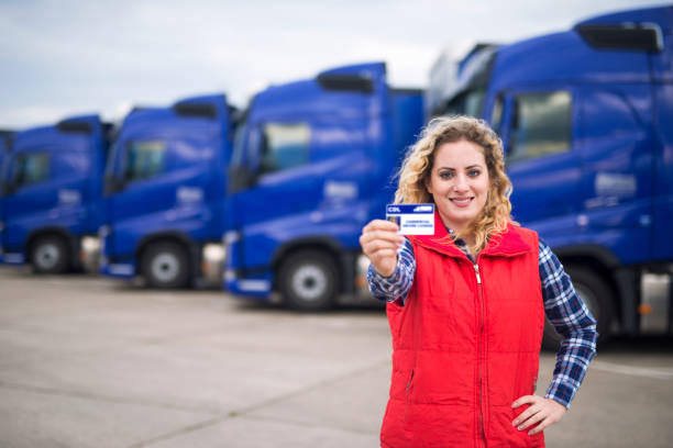 "Truck driver studying online CDL training course on a laptop"