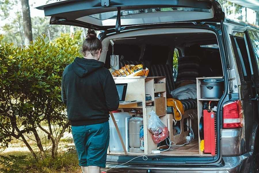 A packed car trunk in a busy city, demonstrating efficient use of space with organized items for a stress-free drive.