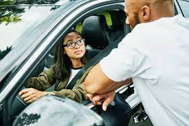 A confident teen driver holding keys, ready to navigate the road safely after completing Get Drivers Ed's comprehensive driving course.