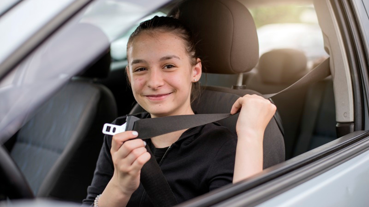 Teen driver practicing behind the wheel with an instructor.