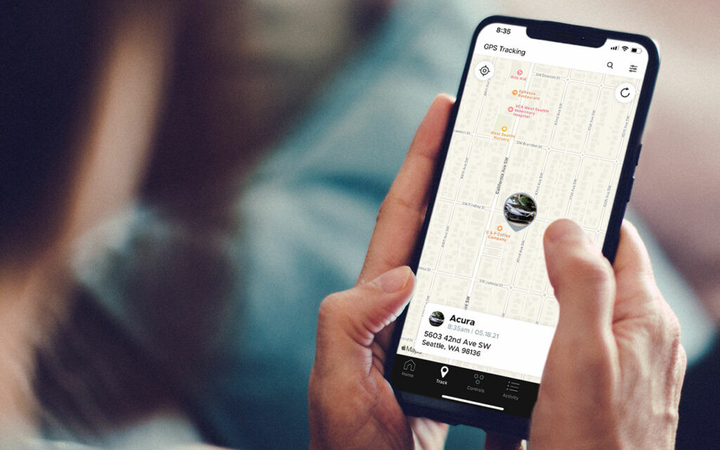 Parent using a mobile app to track their teen driver's location and driving behavior for safety with Get Drivers Ed