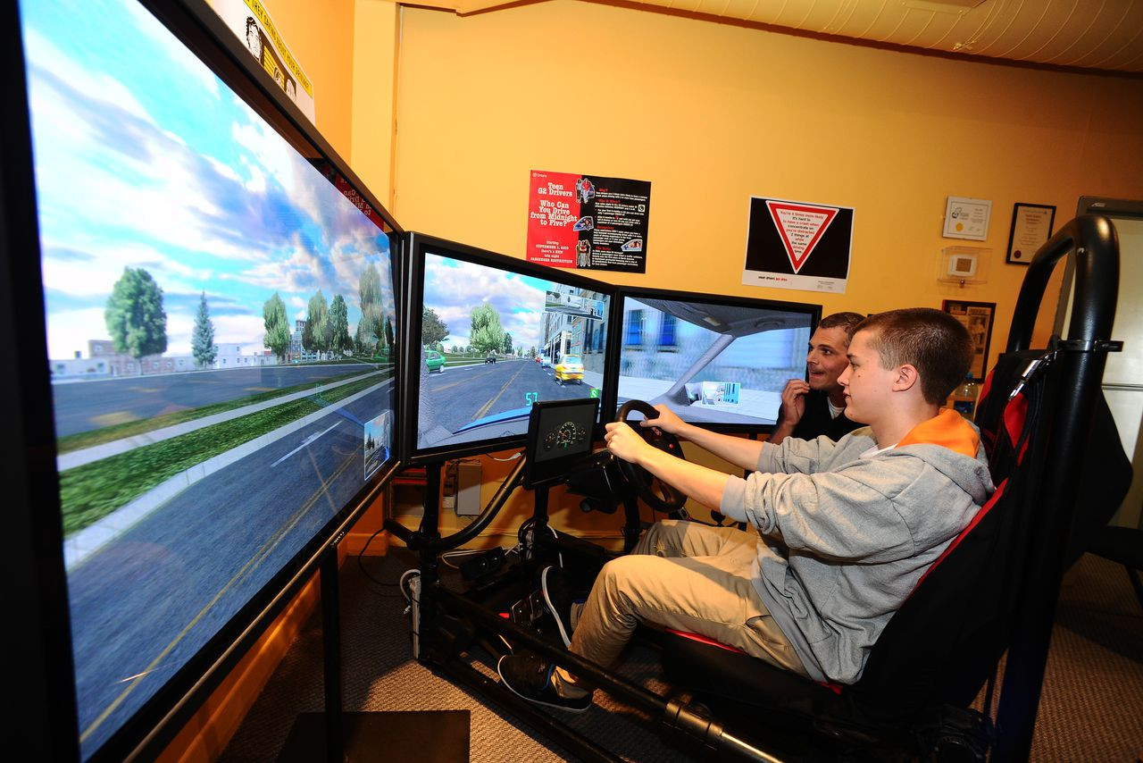 Online learning interface of Get Drivers Ed's Texas Adult Driver Education course on a laptop with Texas roadways in the background.