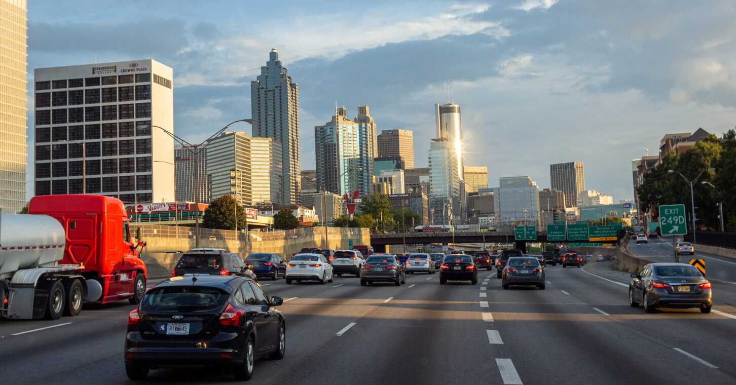 Atlanta highway during rush hour with vehicles navigating safely.