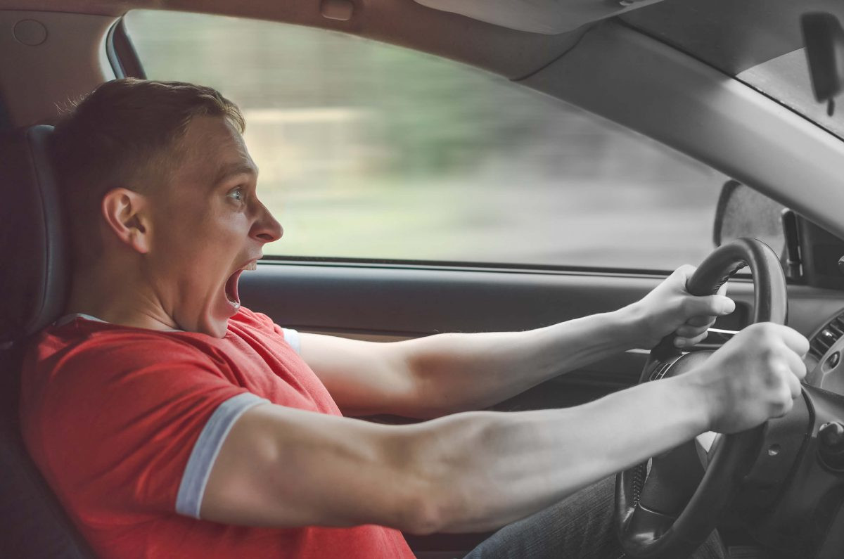 A focused driver practicing emotional control techniques during a driving session at Get Drivers Ed.