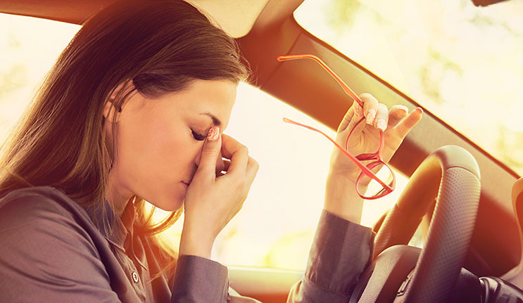 A driver with glasses focusing on the road, demonstrating the importance of vision in driving as taught in Get Drivers Ed's 'drivers ed' course.