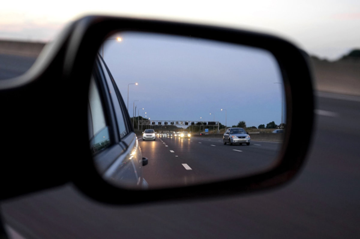 Driver checking blind spot during driving, as taught in Get Drivers Ed course.