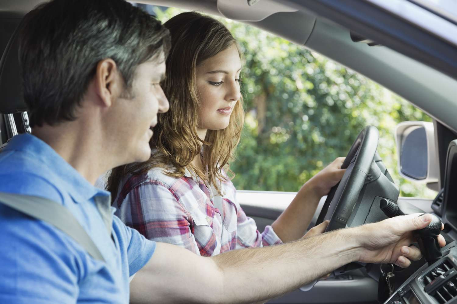 Texas road with a parent teaching a teenager to drive, symbolizing Get Drivers Ed's Parent-Taught Driver's Education program.