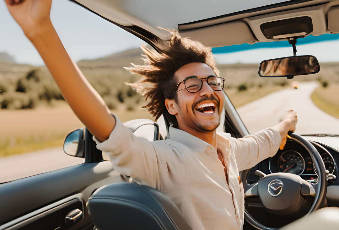 Happy driver enjoying the freedom of the open road, a benefit of learning with Get Drivers Ed.