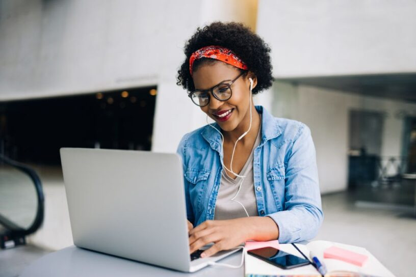 Adult Learner Enjoying Online Drivers Ed Course with Get Drivers Ed on Laptop