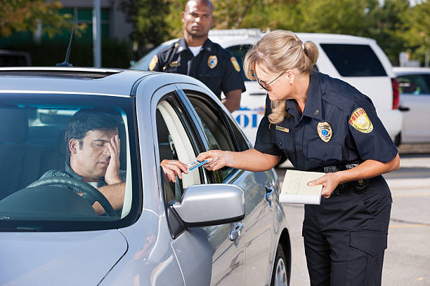 Image depicting a person being pulled over by a police car