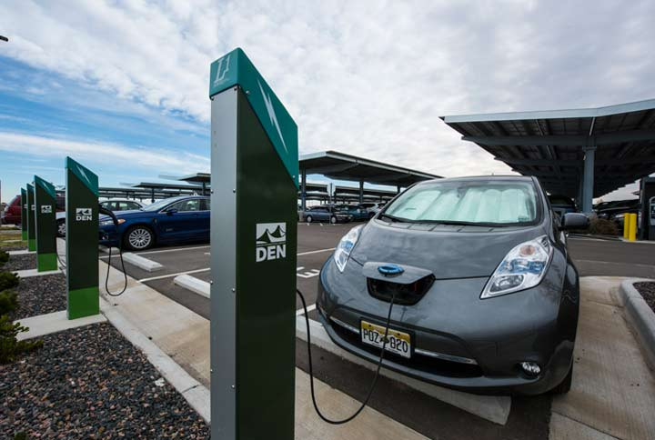 Driver charging an electric vehicle, educated about EV technology by Get Drivers Ed.