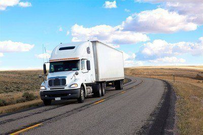 A student at Get Drivers Ed practices driving a large truck as part of their CDL training course.