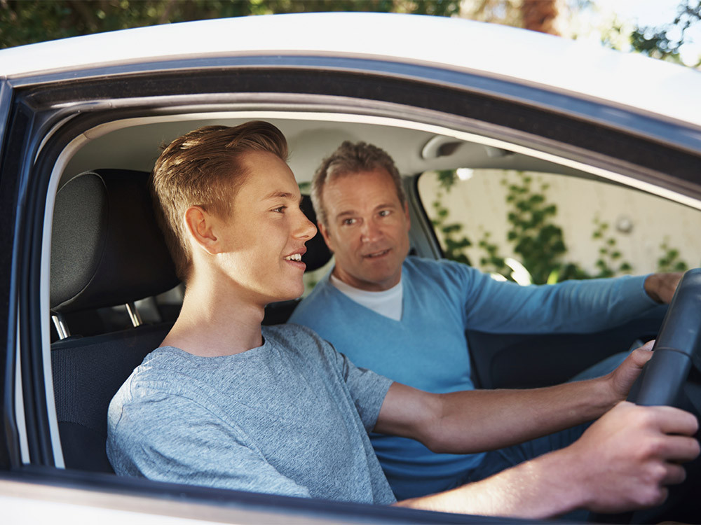 Teen student driving under supervision during a Get Drivers Ed session, learning safe driving techniques.