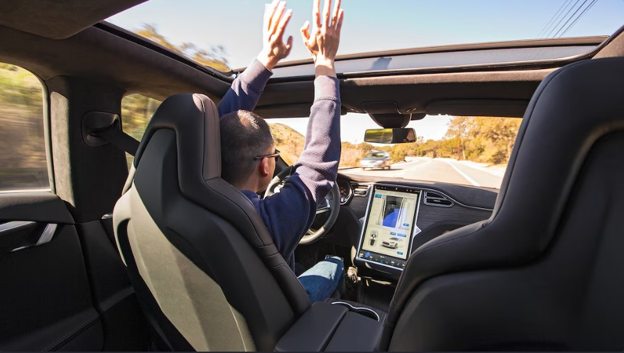 A self-driving car on a road, surrounded by digital icons representing sensors and autonomous driving technology.