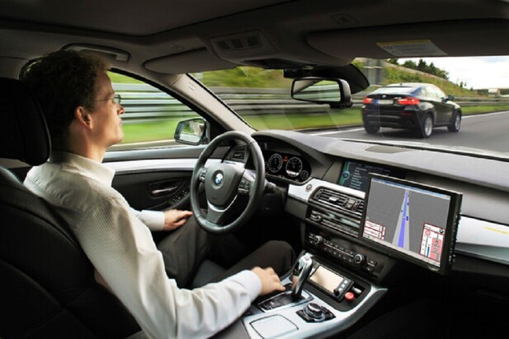 A modern car interior with a dash cam and head-up display showing driving information to promote safer driving habits.