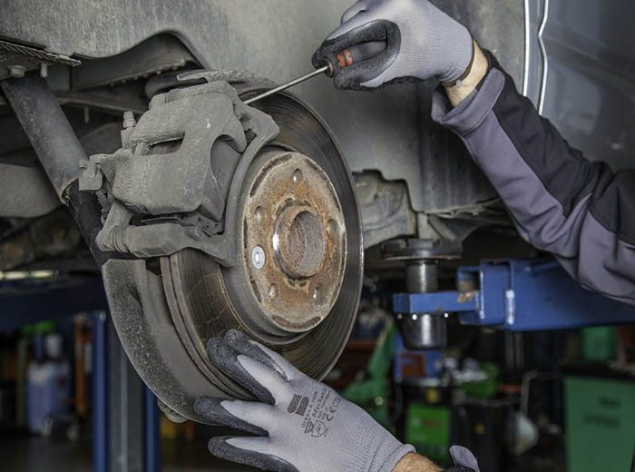 Close-up of a car's braking system, highlighting the importance of regular brake care