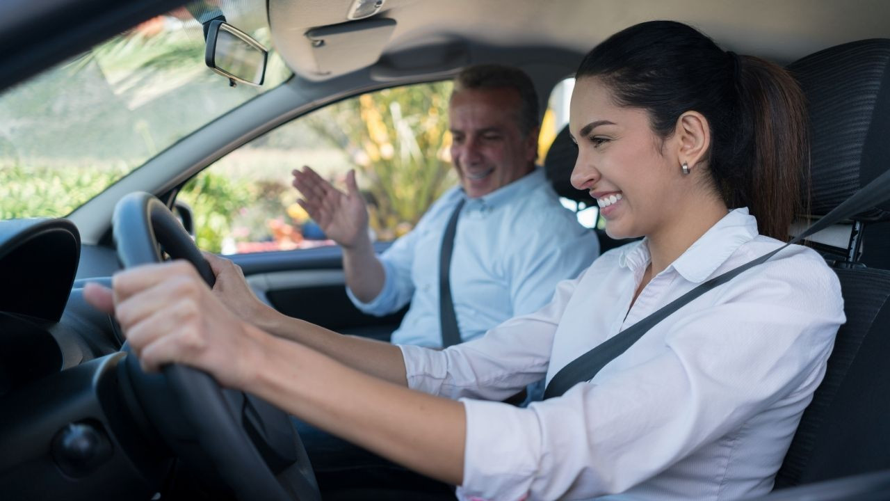 A new Texas resident happily holding their new Texas driver's license, achieved with the help of Get Drivers Ed's 'drivers ed' courses.