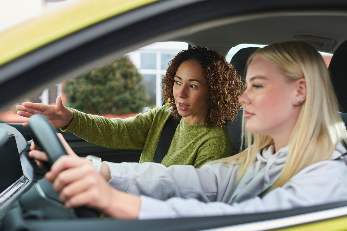 Confident Adult Holding Driver's License - Get Drivers Ed Success