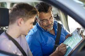 "Expert Driving Instructor Demonstrating Professional Driving Techniques to a Student at Get Drivers Ed, Emphasizing Safety and Skill."