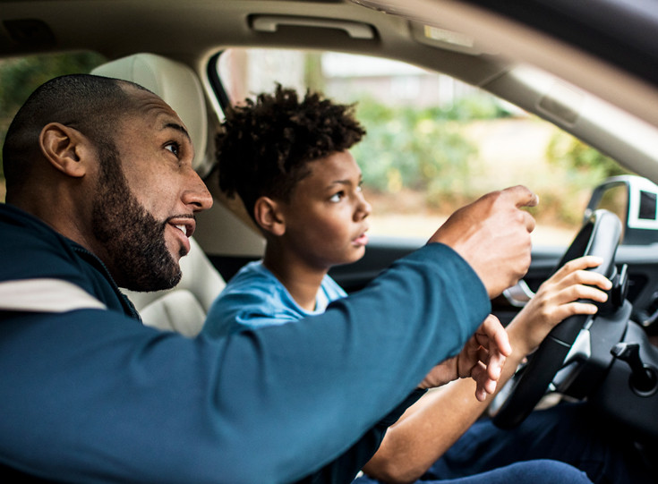 Parent teaching their teen how to drive safely using Get Drivers Ed's Parent-Taught Drivers Ed program.