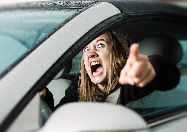 A calm driver practicing safe driving techniques, focused on the road with a peaceful expression, highlighting the importance of managing road rage.