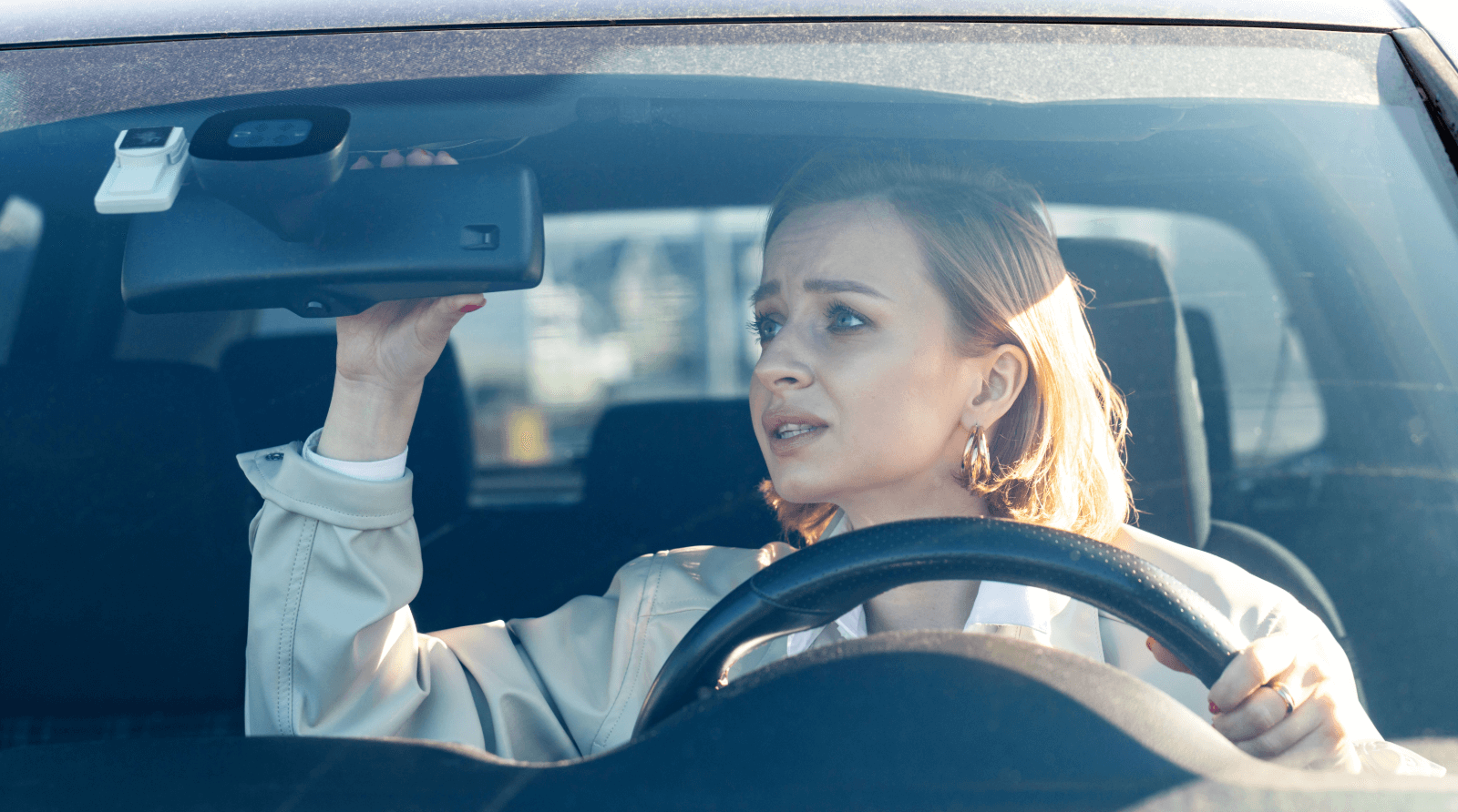 Anxious driver gripping steering wheel, emphasizing the importance of drivers ed