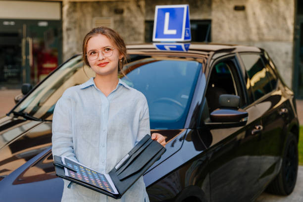 "Driving instructor guiding a student driver during a practical lesson"