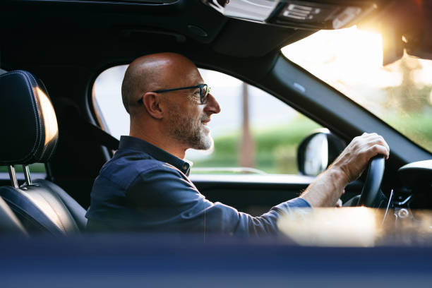 A driver practicing safe driving habits on a clear road, maintaining a proper speed and using turn signals for confident and responsible driving.