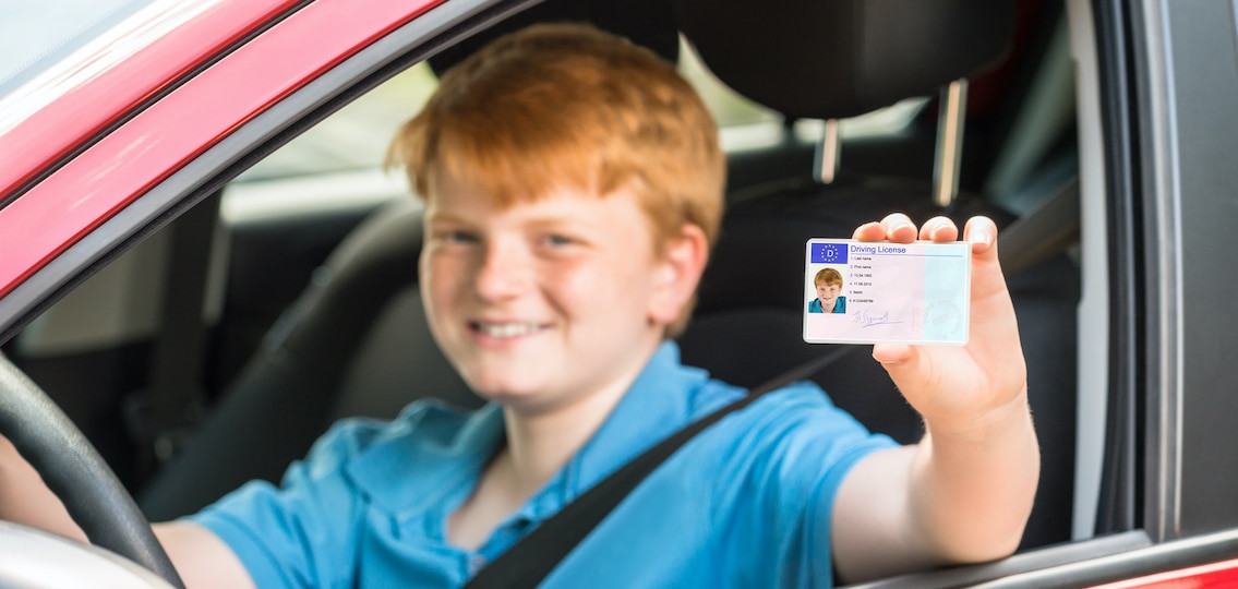 Texas driver's license being handed over with Texas flag background