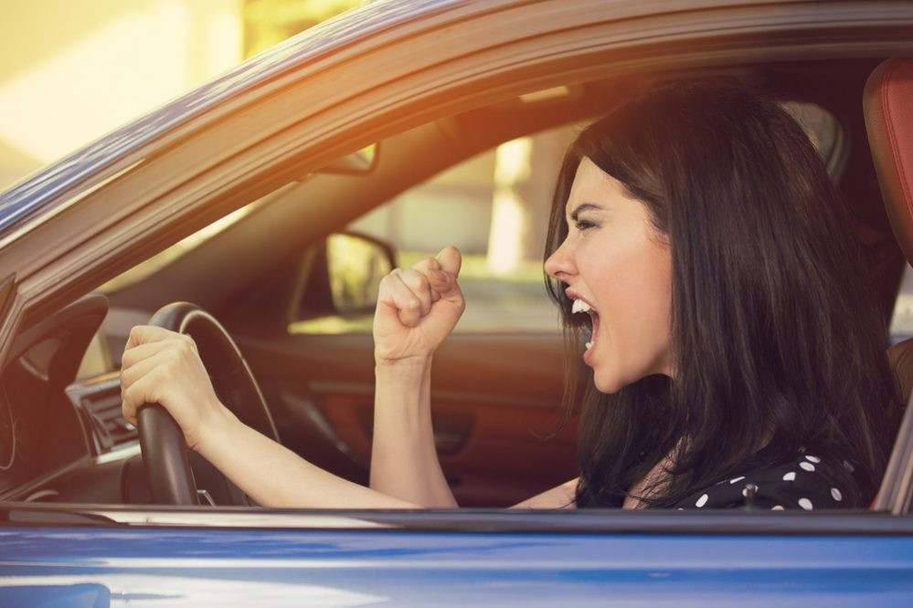 Driver navigating a busy road, learning to overcome driving challenges with Get Drivers Ed