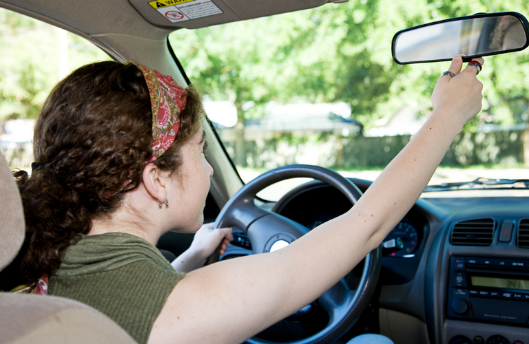 Adult learner taking an online drivers ed course with Get Drivers Ed to enhance driving skills