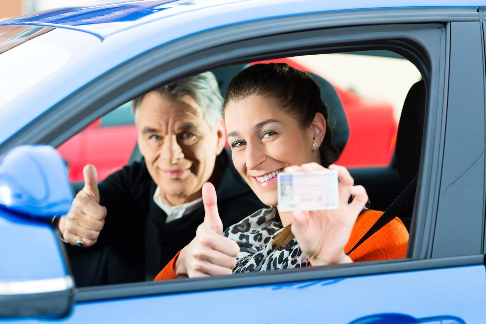 An adult student learning to drive with a supportive instructor from Get Drivers Ed, emphasizing tailored education for adults.