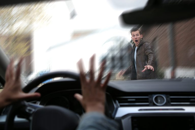 A driver attentively navigating the road, demonstrating defensive driving techniques learned from an online defensive driving course.