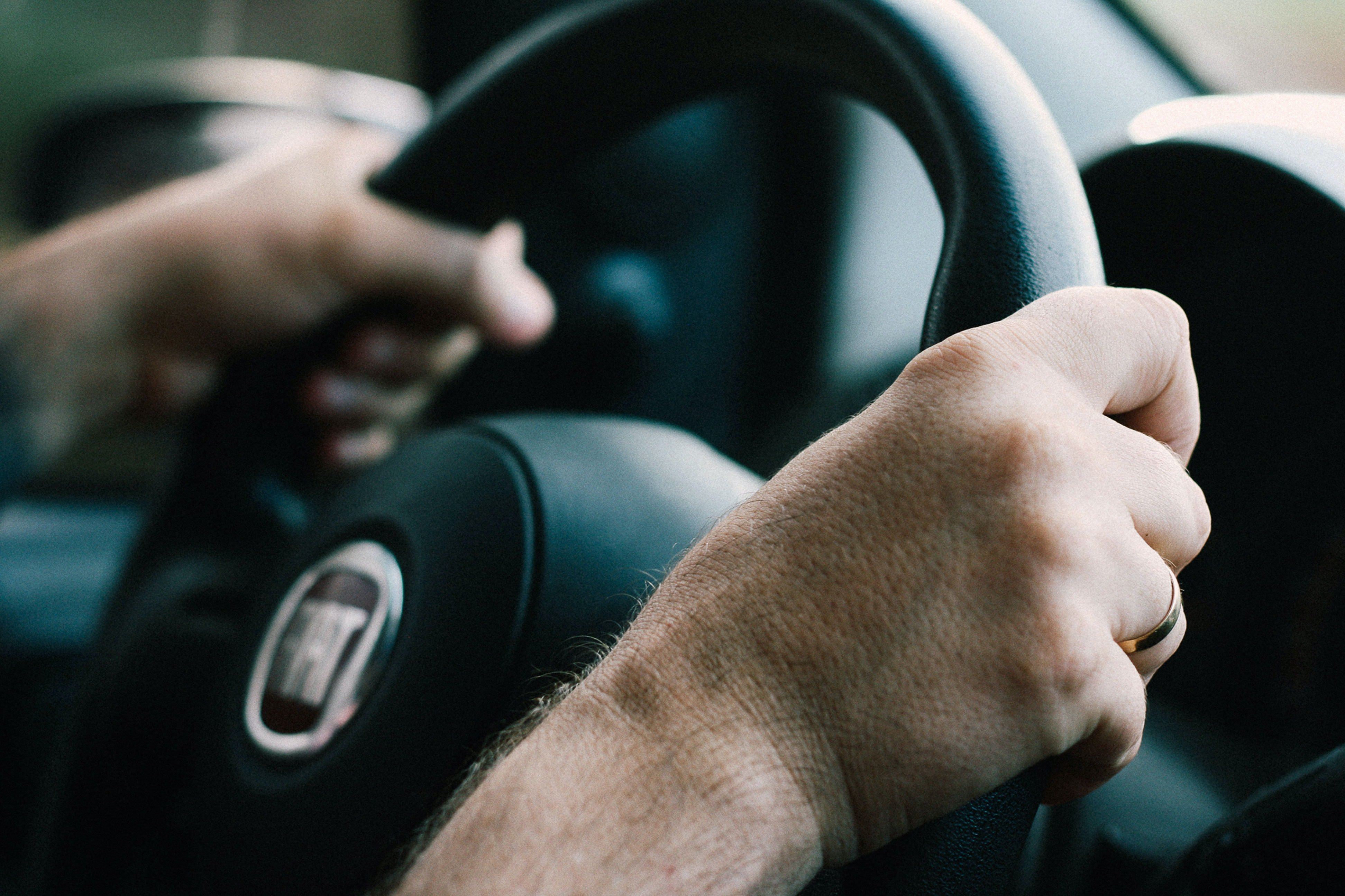 Driver confidently using smart car technology, guided by Get Drivers Ed's expert training.