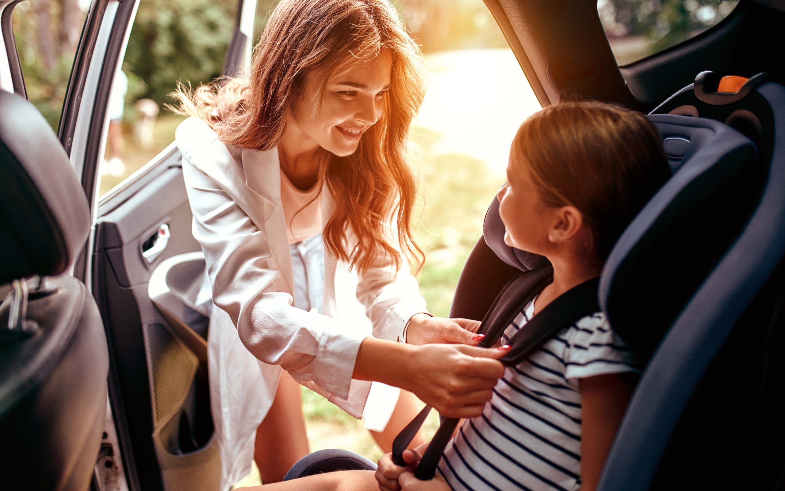 A properly installed car seat in a vehicle, ensuring child safety on the road.