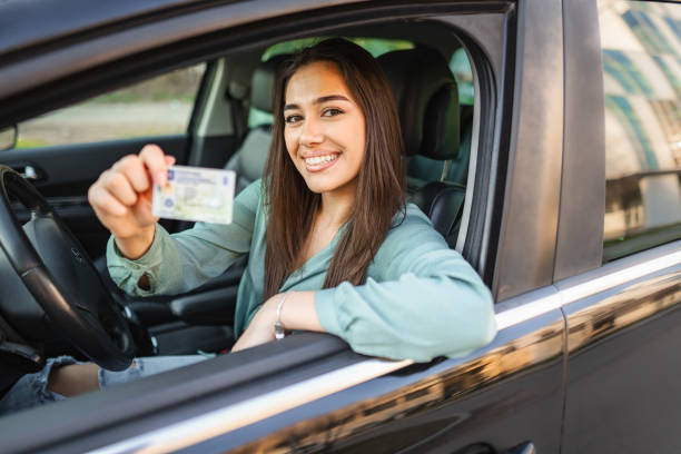 "Person receiving their driver's license at the Austin DMV after completing drivers ed with Get Drivers Ed"