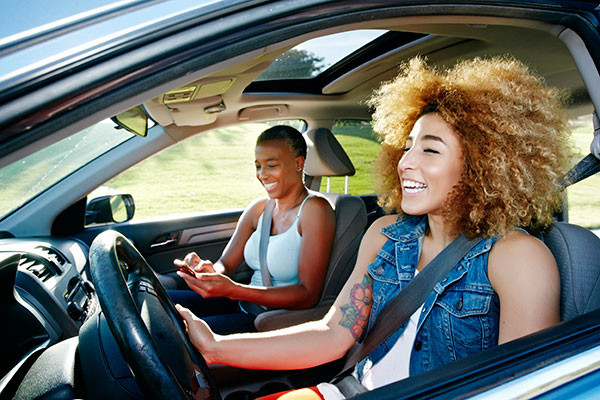 Passenger helping driver navigate, emphasizing the importance of supportive driving habits with Get Drivers Ed