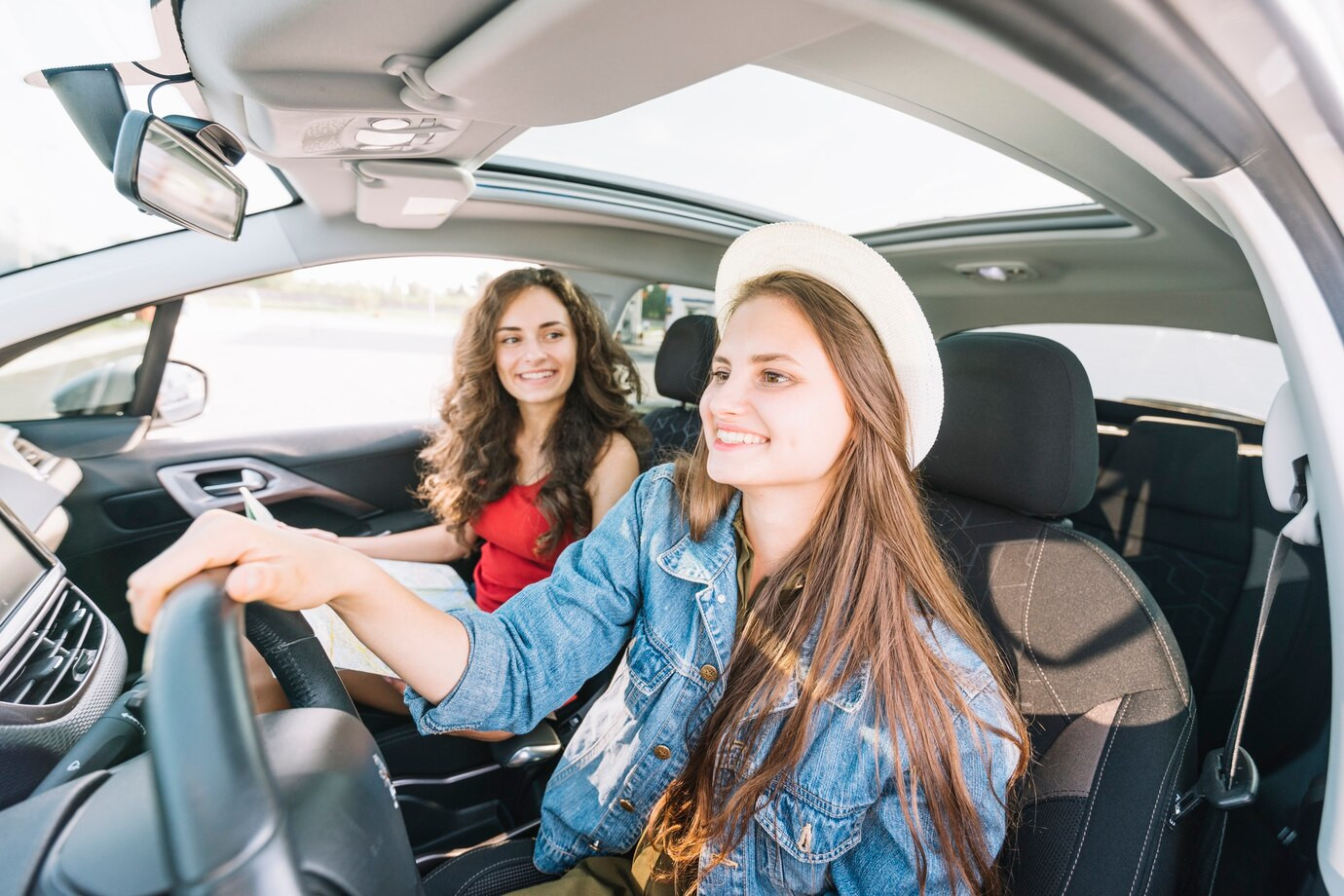 Teenager driving with instructor on the road