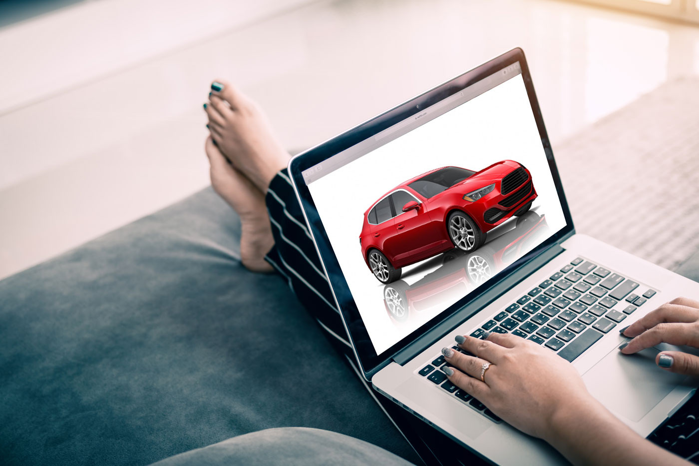 Researching for Car Purchase on Laptop