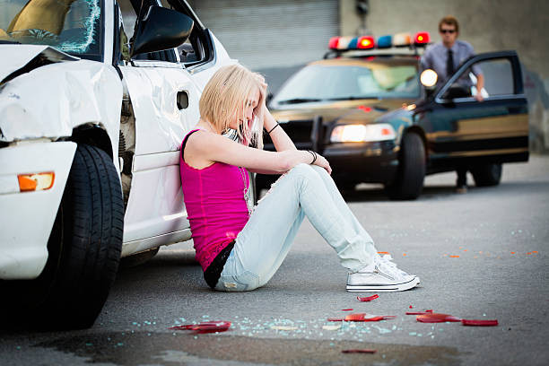 "Driver assessing the scene after a car accident with Get Drivers Ed guidance"