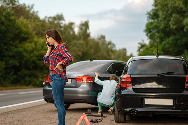 A driver handling a road emergency with safety precautions.