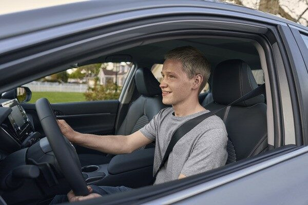 New driver safely navigating Dallas traffic with Get Drivers Ed instructions