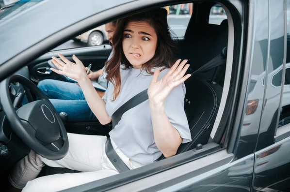 A new driver learning to avoid common driving mistakes with guidance from GET DRIVERS ED.