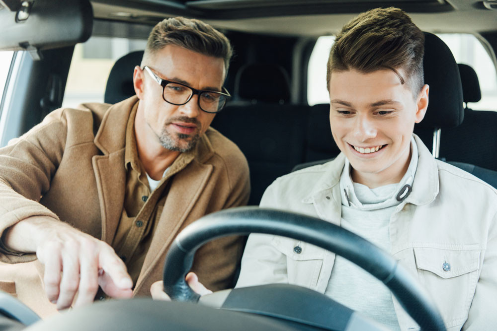 Confident Driver Smiling Behind the Wheel After Completing Get Drivers Ed Course