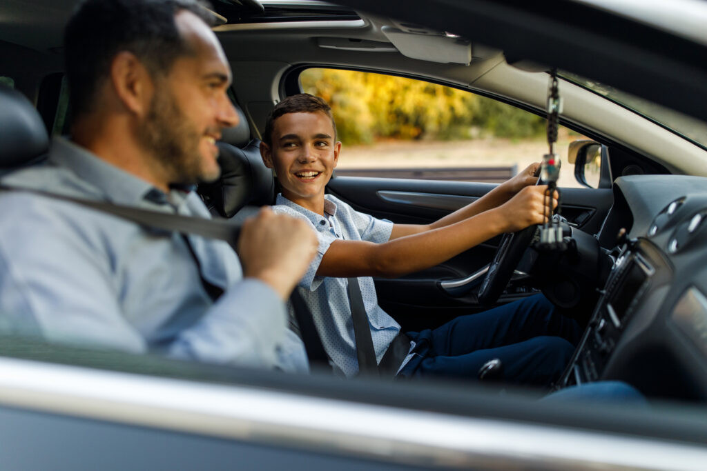 A teenager learning to drive with a professional instructor from Get Drivers Ed, focusing on safety and confidence on the road.