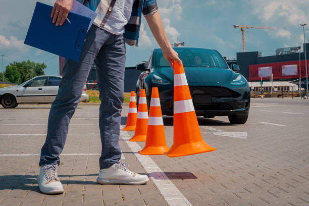 A confident student driver receiving guidance from a qualified driving instructor.